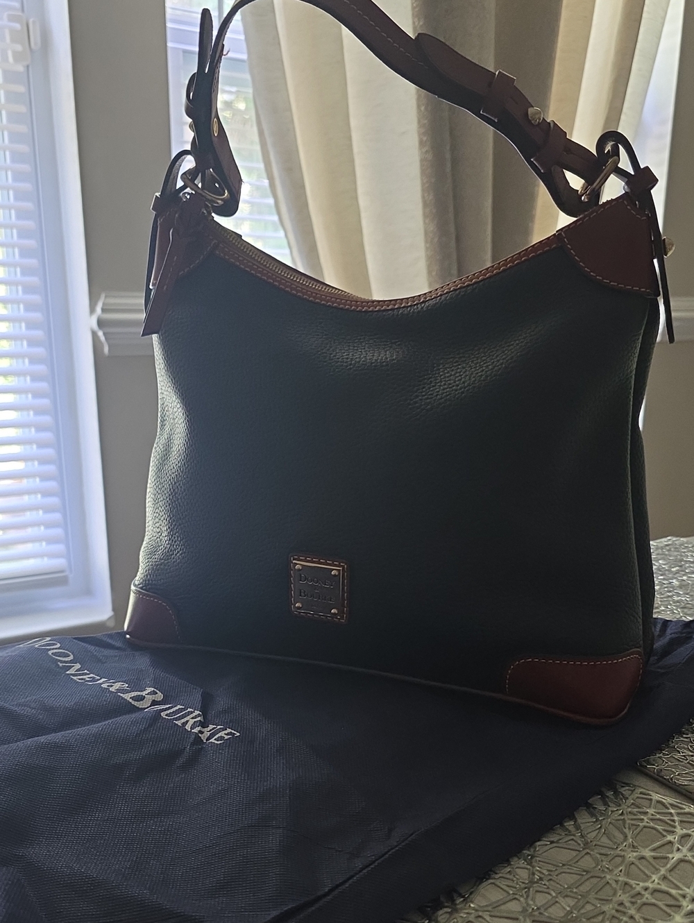 Dooney & Bourke Black Pebble Leather Messenger Bag with Brown Trim